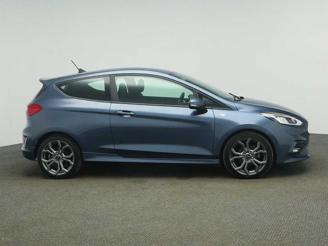 Side view of Ford Fiesta in showroom
