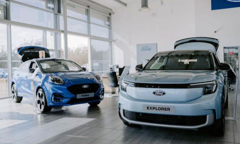 Ford puma and ford explorer inside a dealership showroom