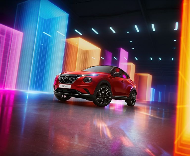 2025 Nissan Juke in red exterior driving shot