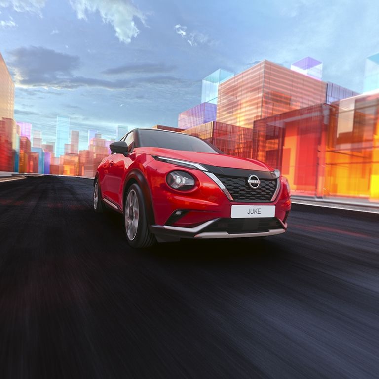 2025 Nissan Juke in red exterior driving shot