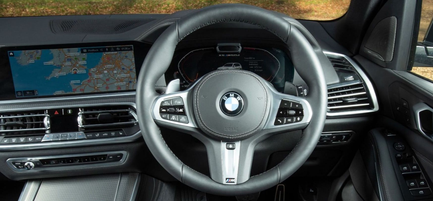 Close up of interior with steering wheel of BMW x5