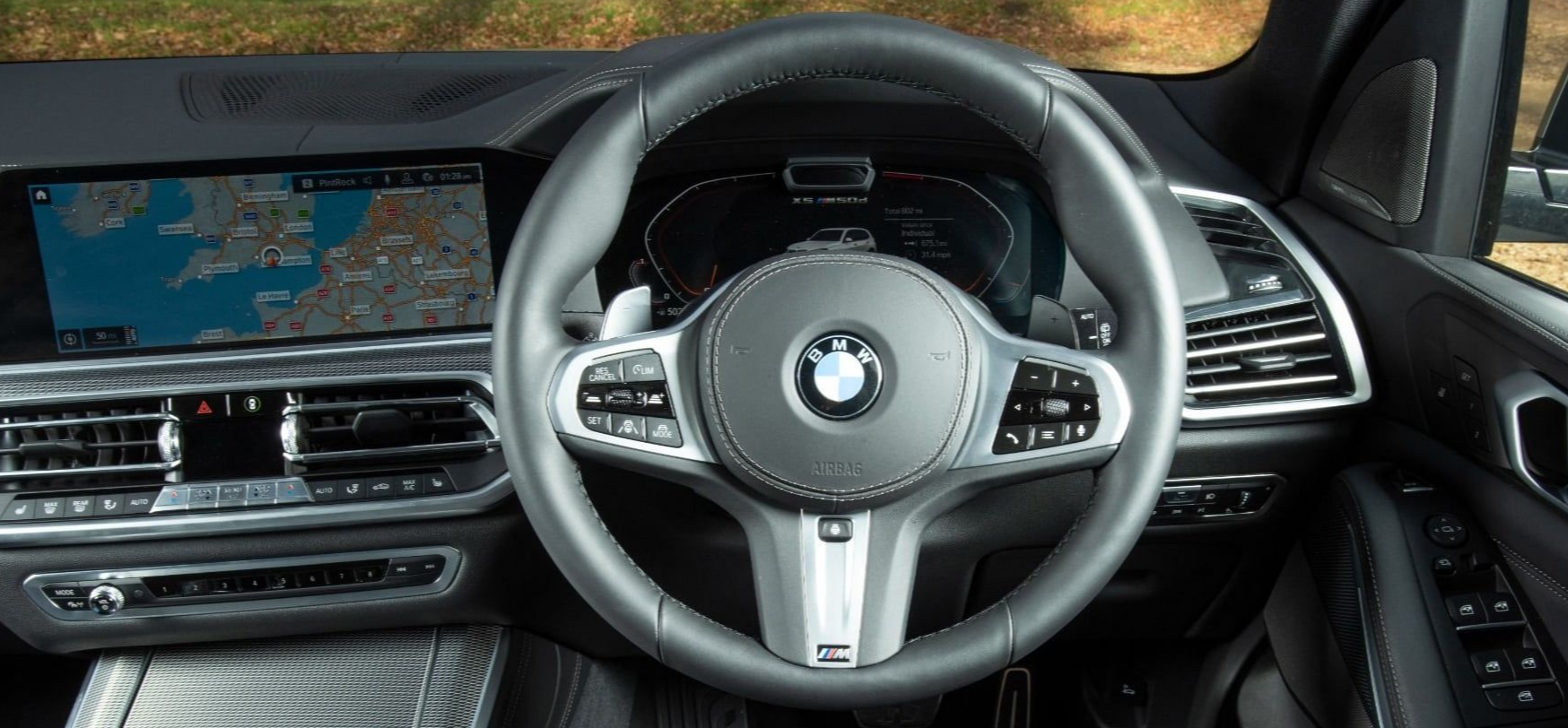 BMW X5 Close up of interior with steering wheel of BMW x5