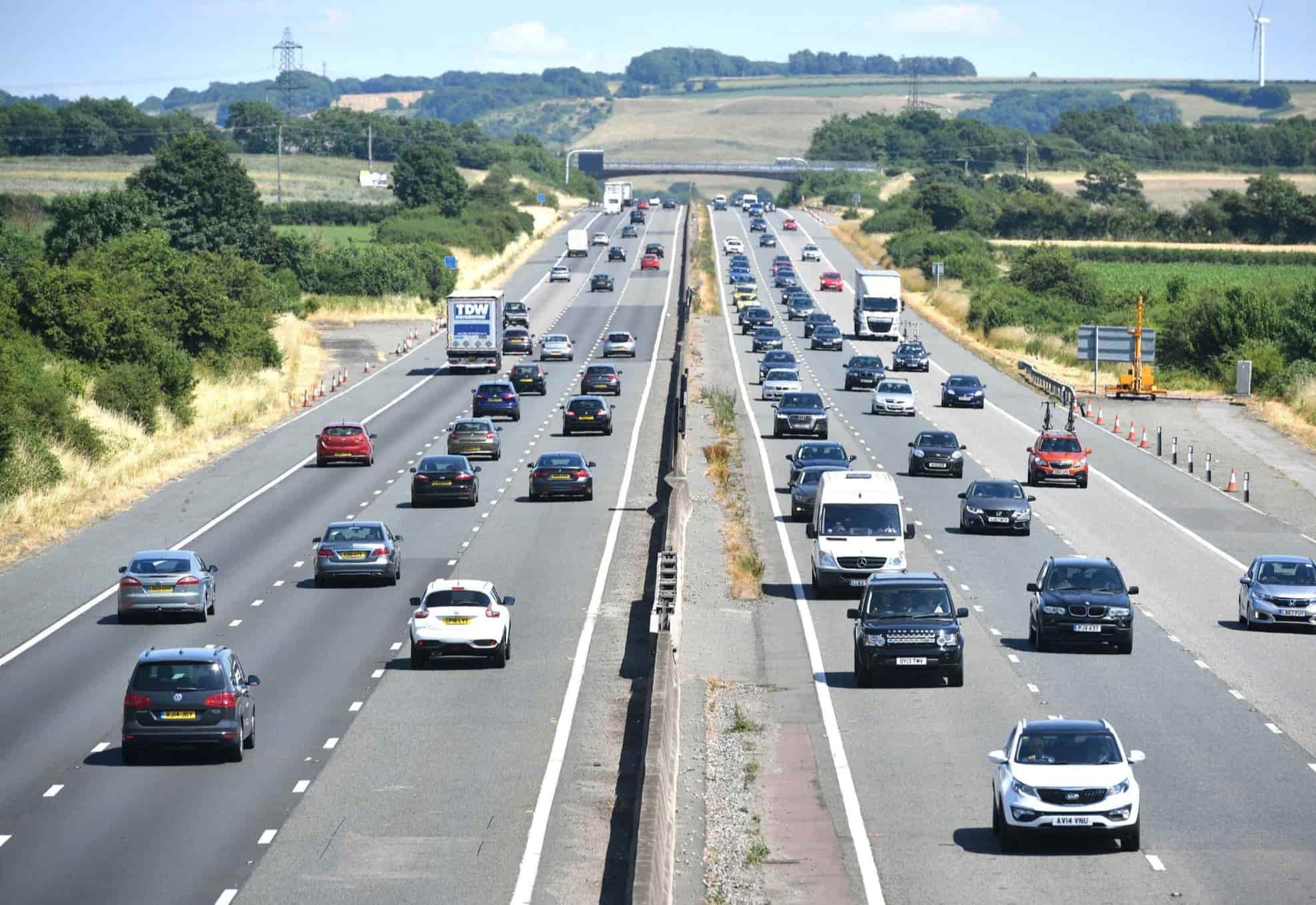 Lots of cars driving on a busy motorway