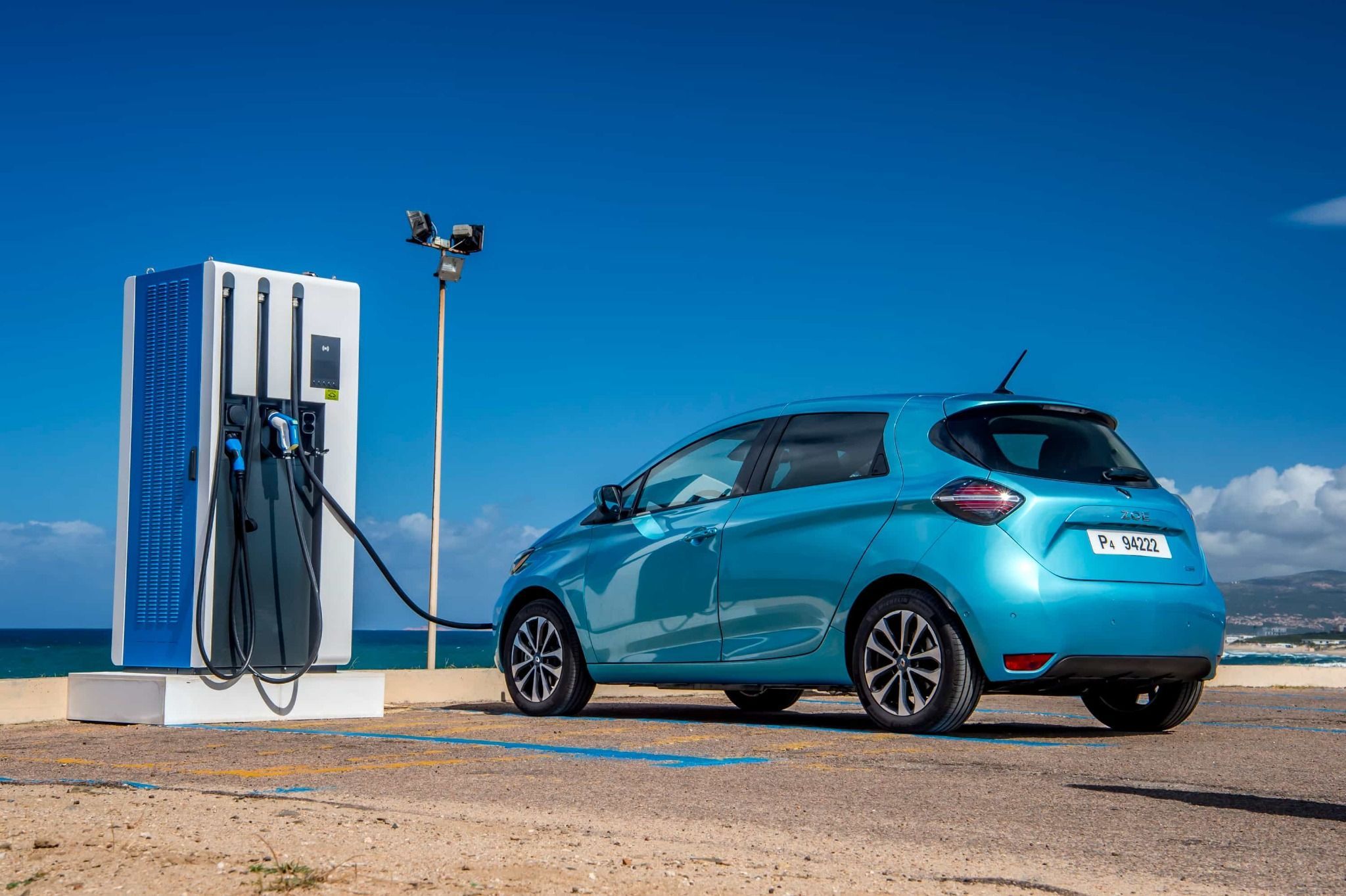 rear side view of renault zoe at an electric charging point