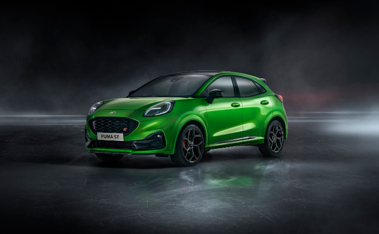front view of a green Ford Puma with a grey smokey background