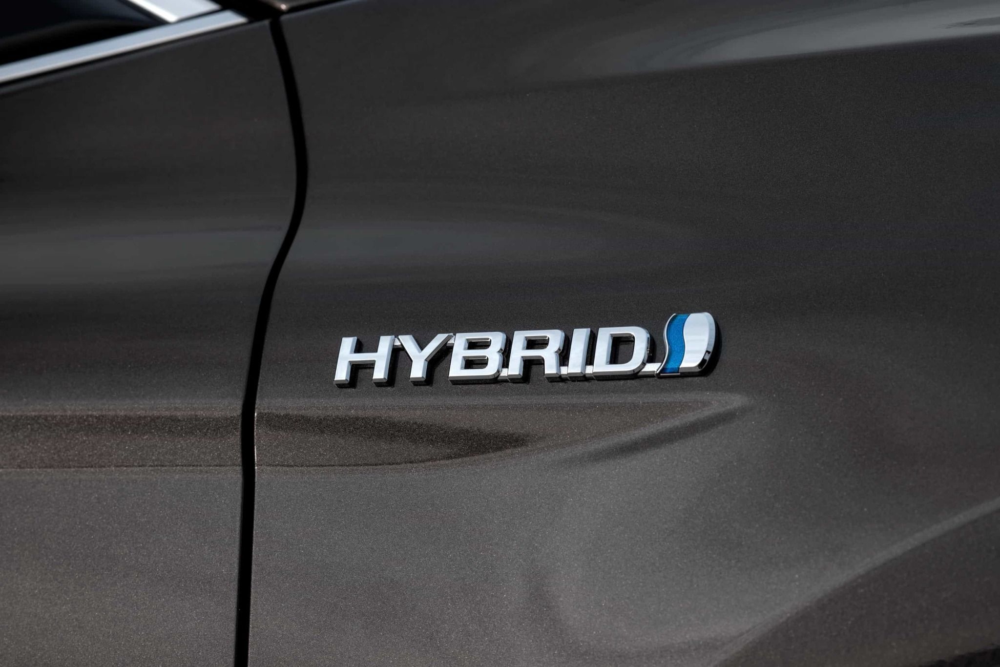 close up of the toyota camry hybrid badge