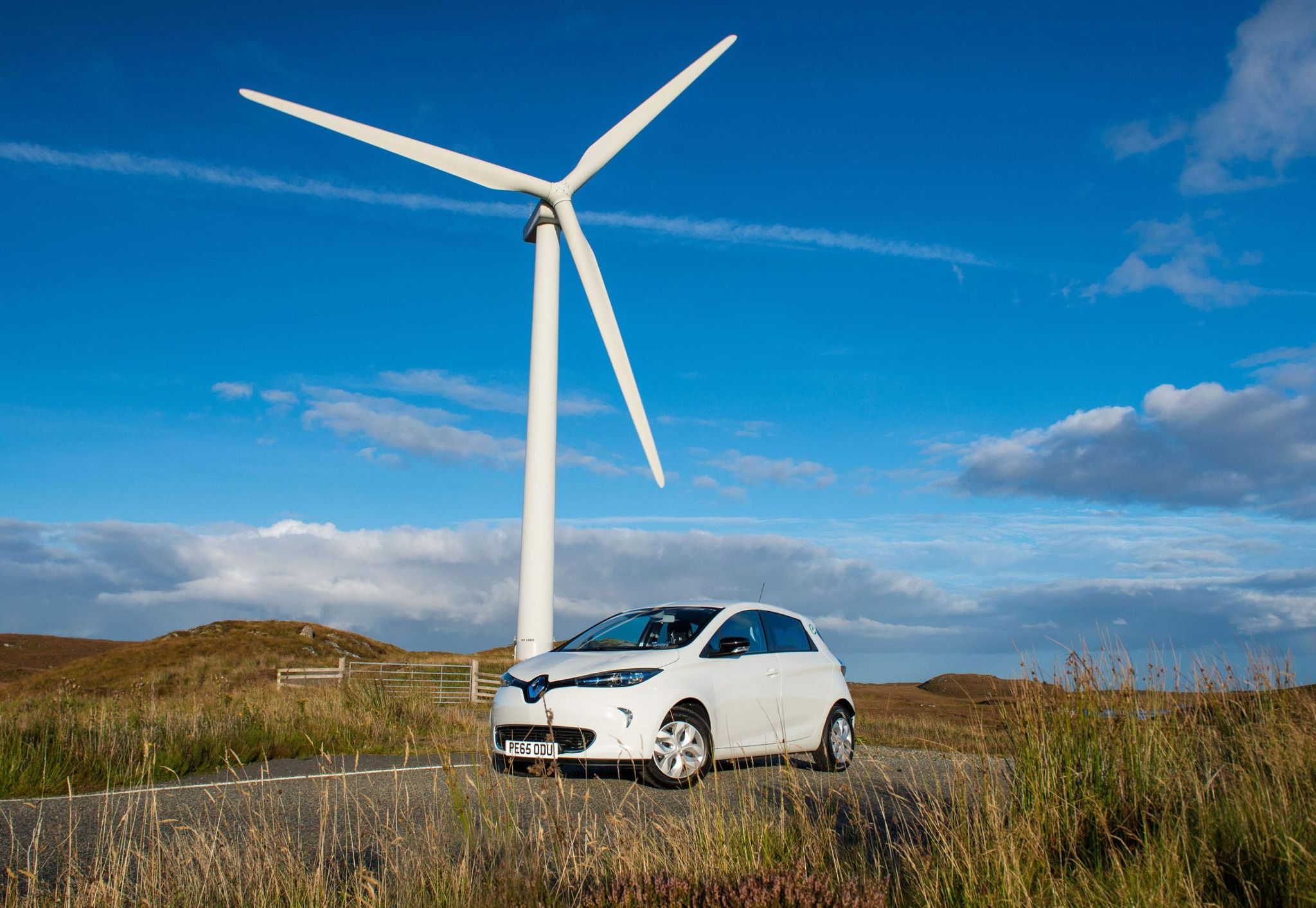 Electric Renault next to Wind Turbine