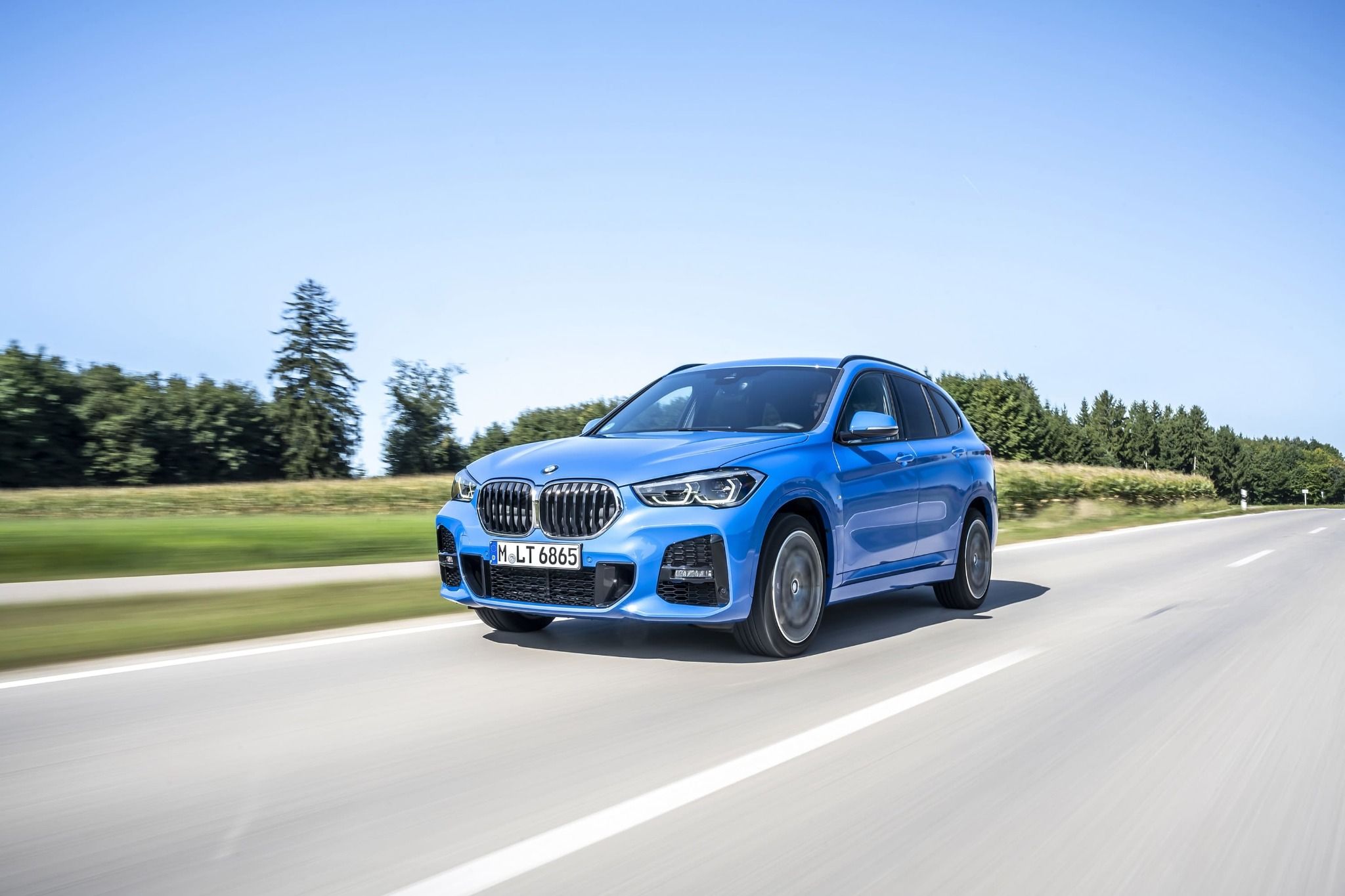 blue bmw x1 driving