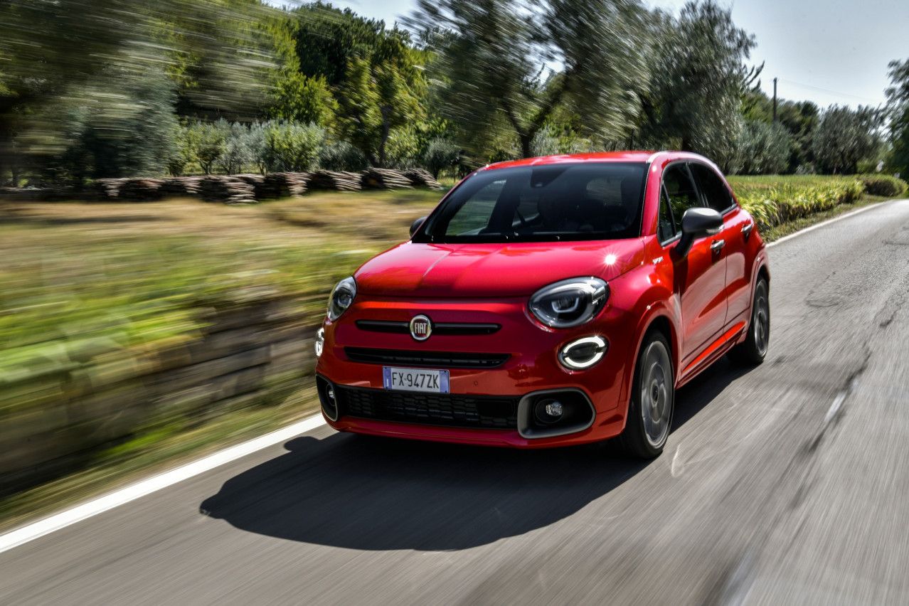 red Fiat 500x Sport driving on a road