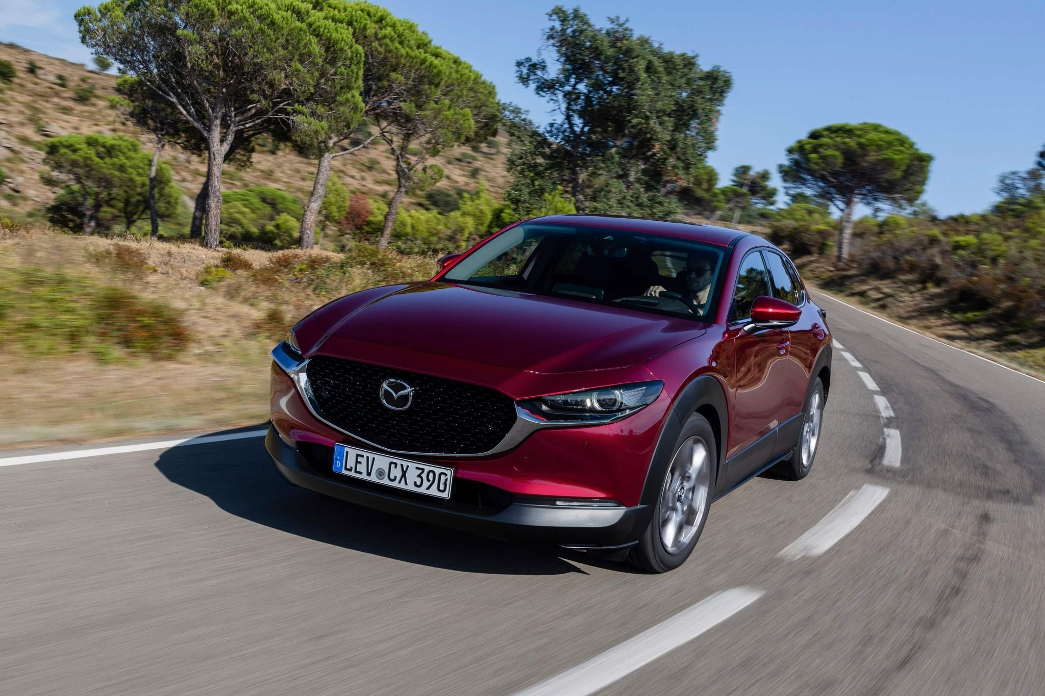 Red Mazda CX-30 Driving
