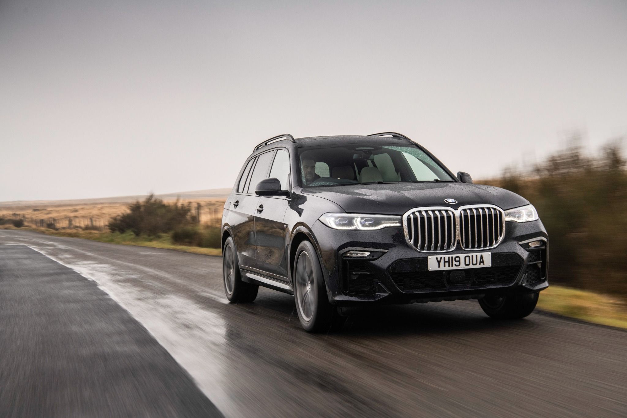 Front view of the BMW X7 driving along a road