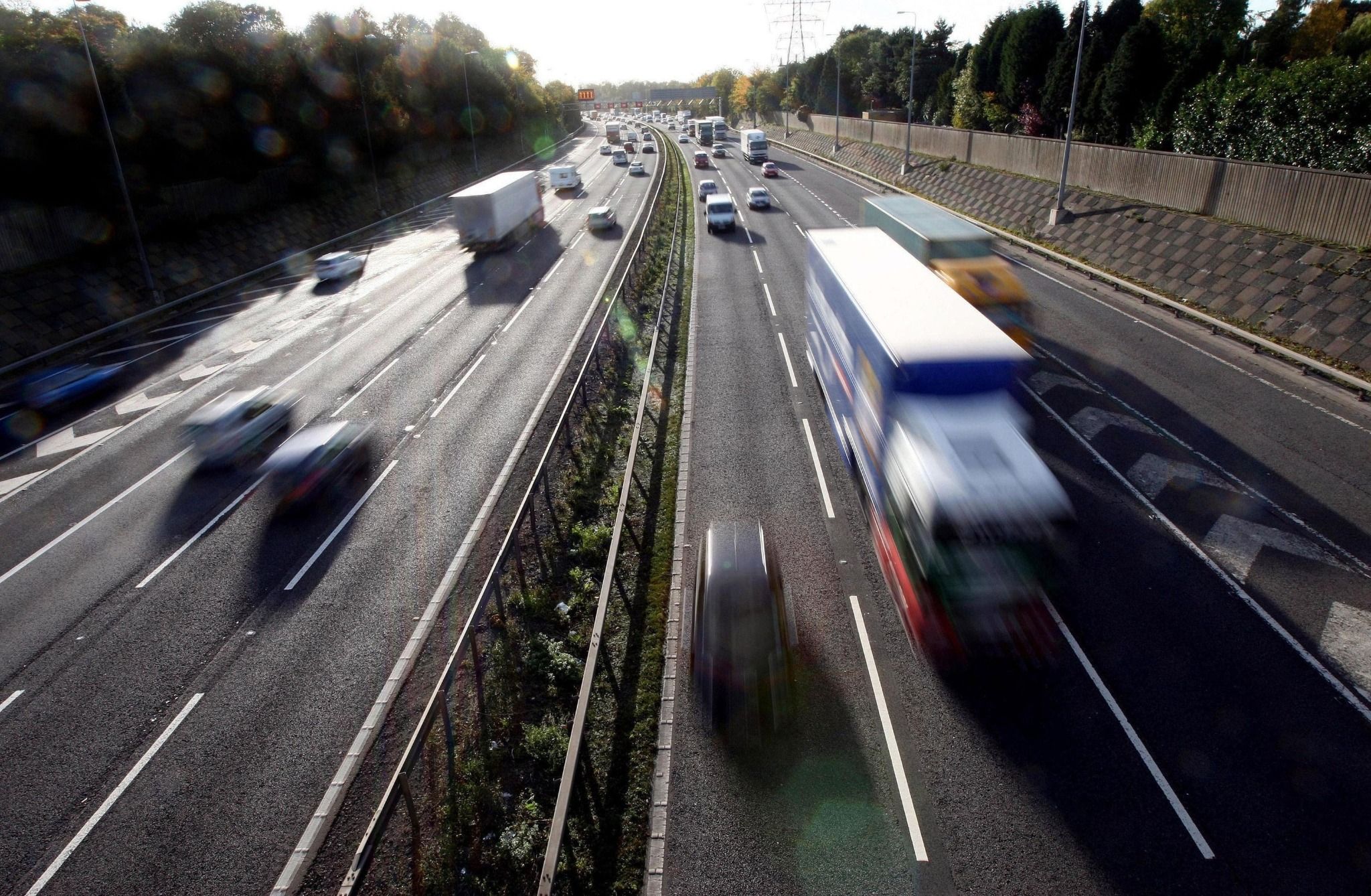 overview of lorries and cars driving on a motorway