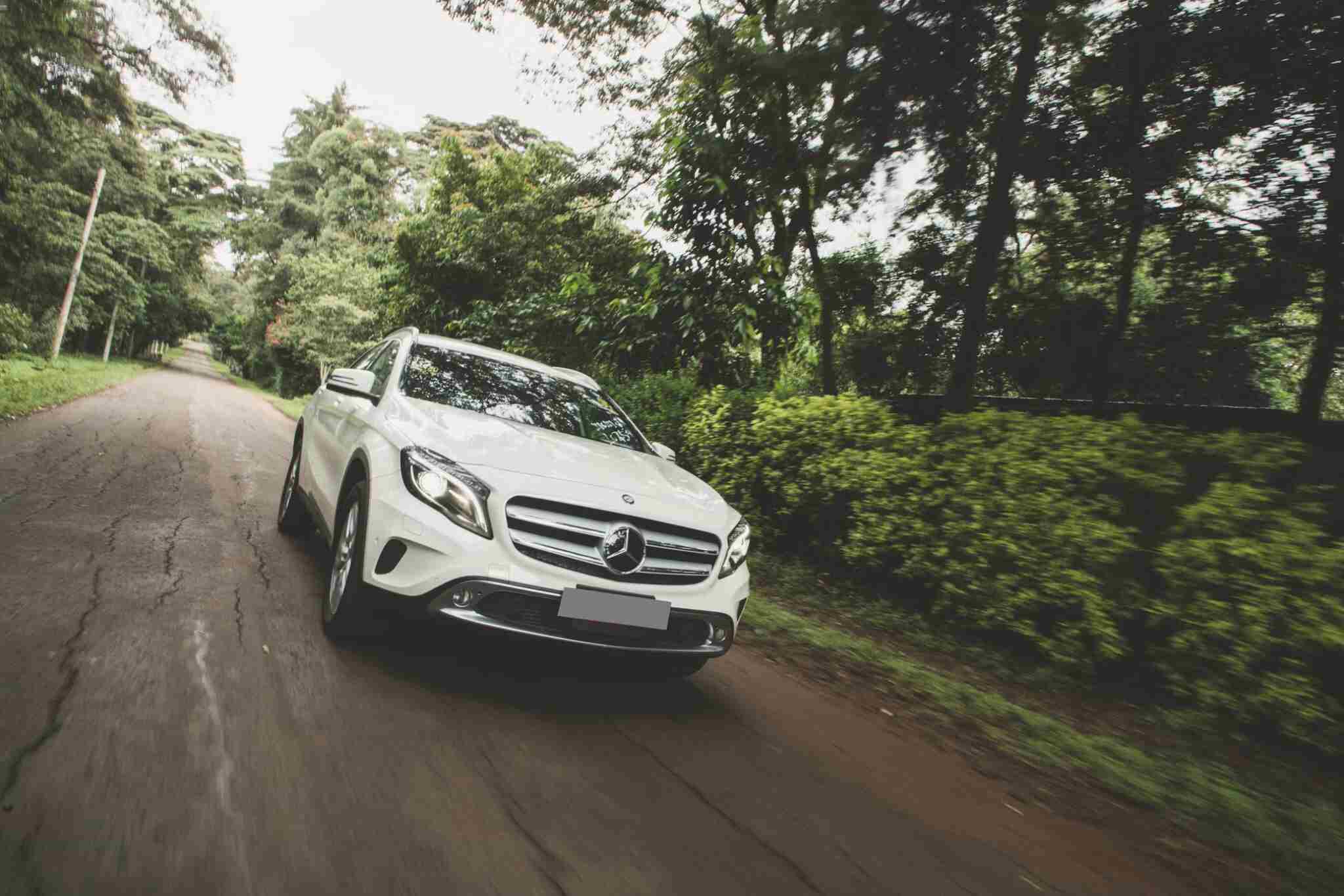 Mercedes Driving Down the Road