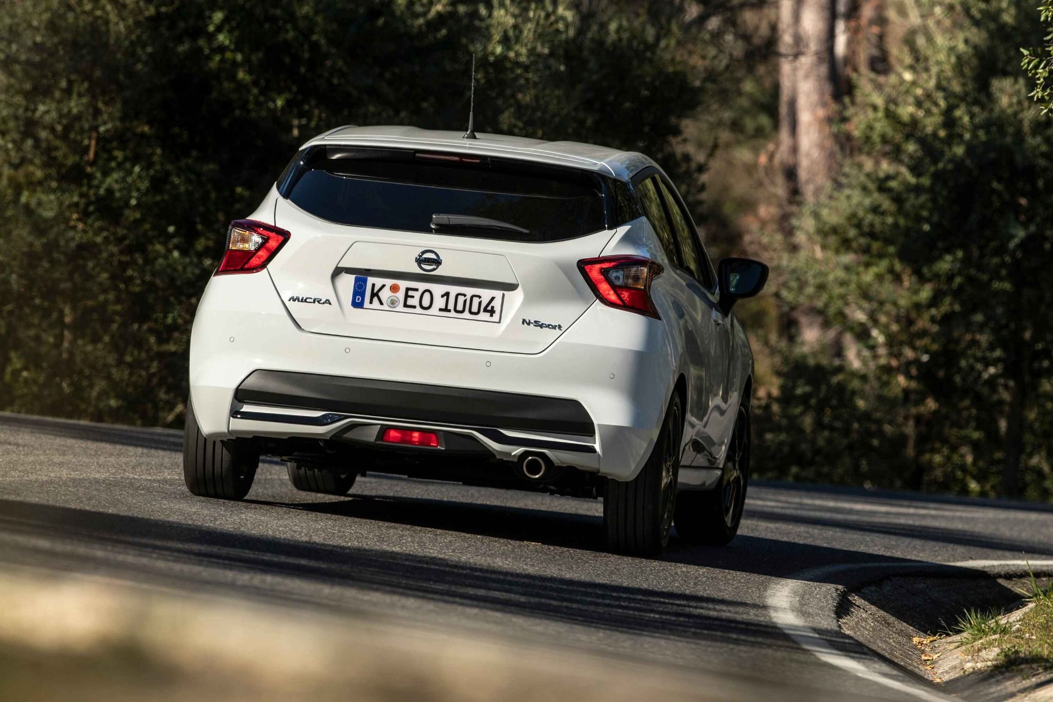 White Nissan Micra on a Road