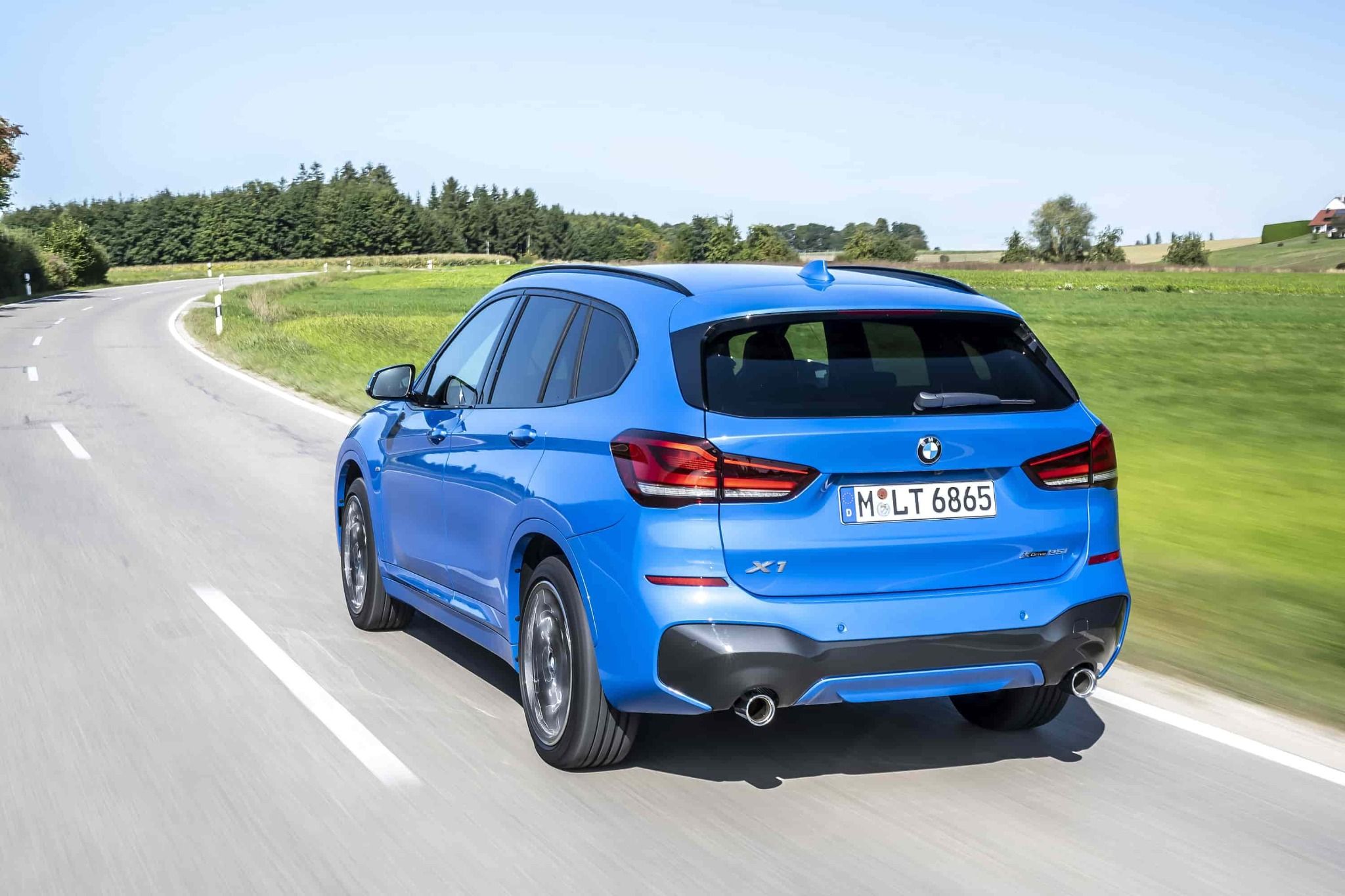rear of a bmw x1 driving