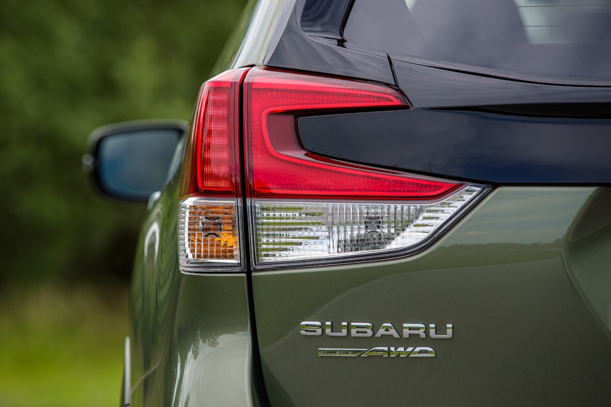 close up of green subaru rear lights