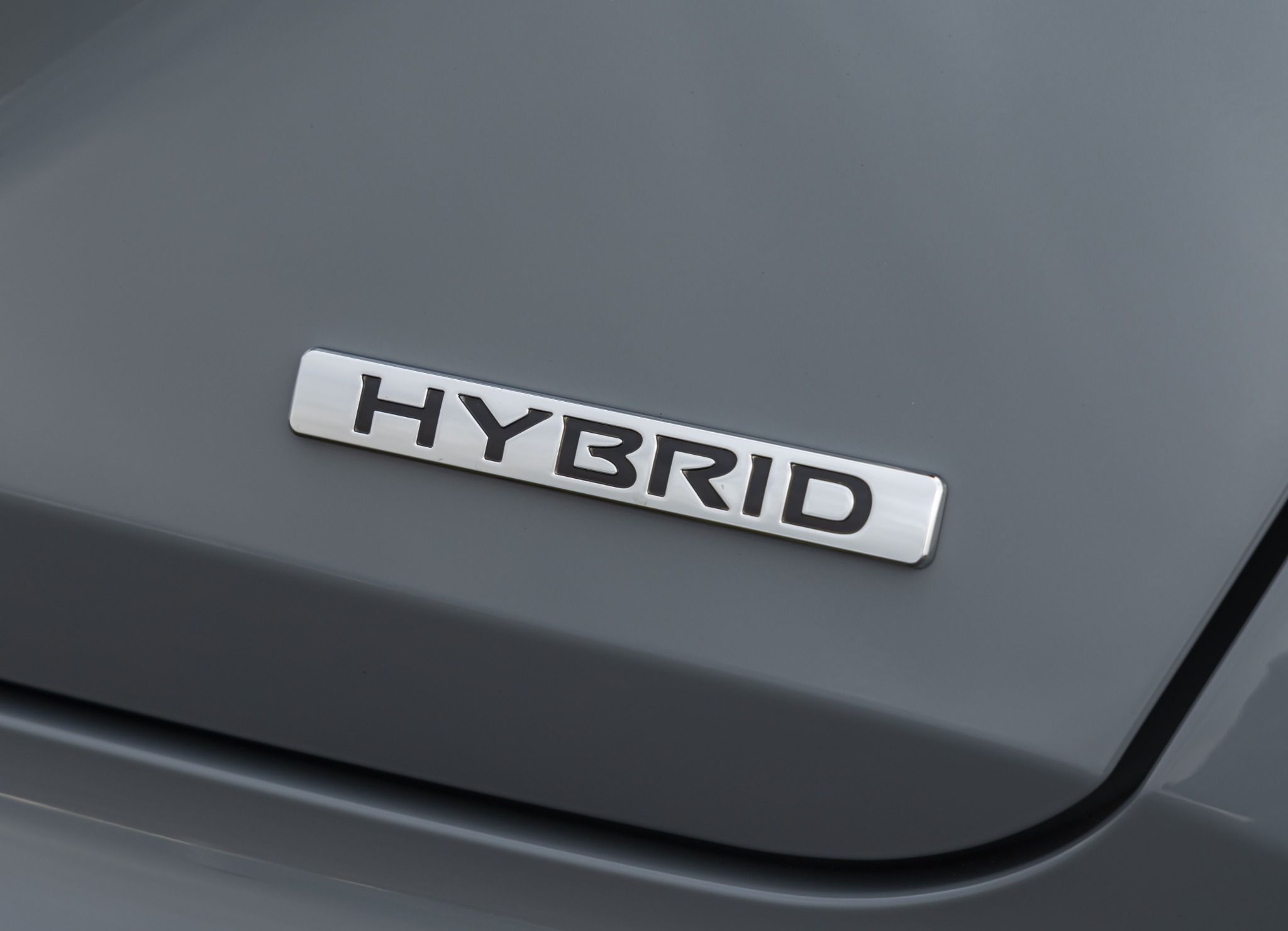 Grey Nissan Juke Hybrid badge