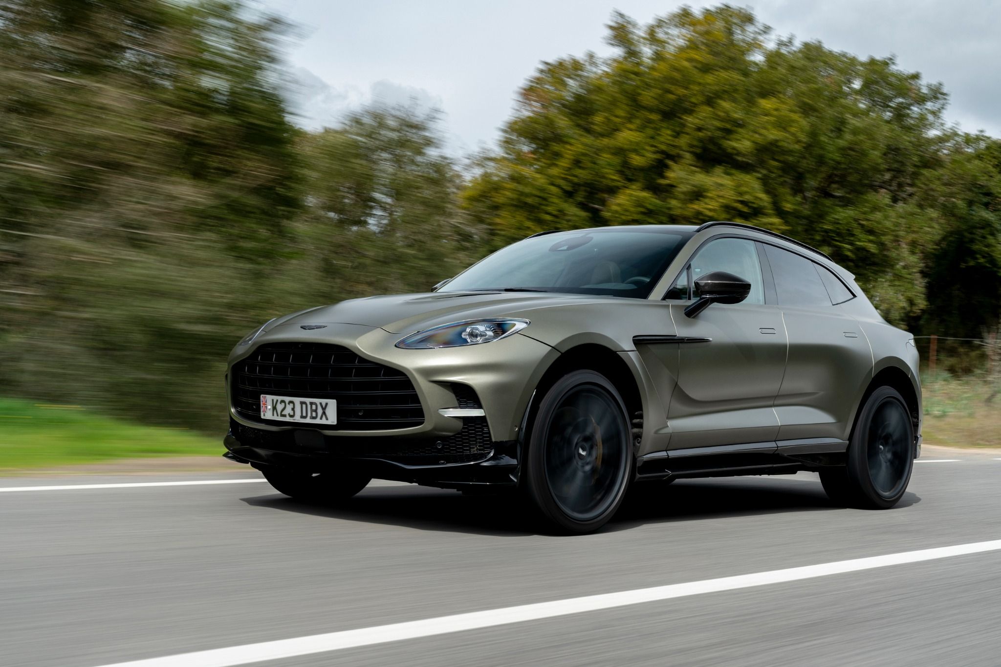 Aston Martin DBX driving on a road