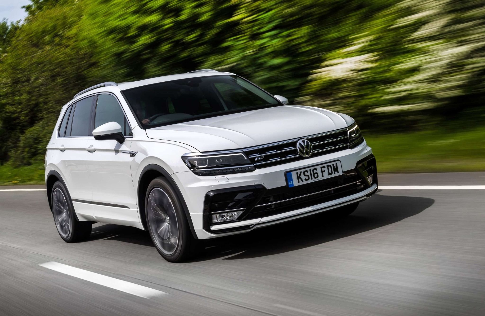 Whit eVW Tiguan Driving Down the Road