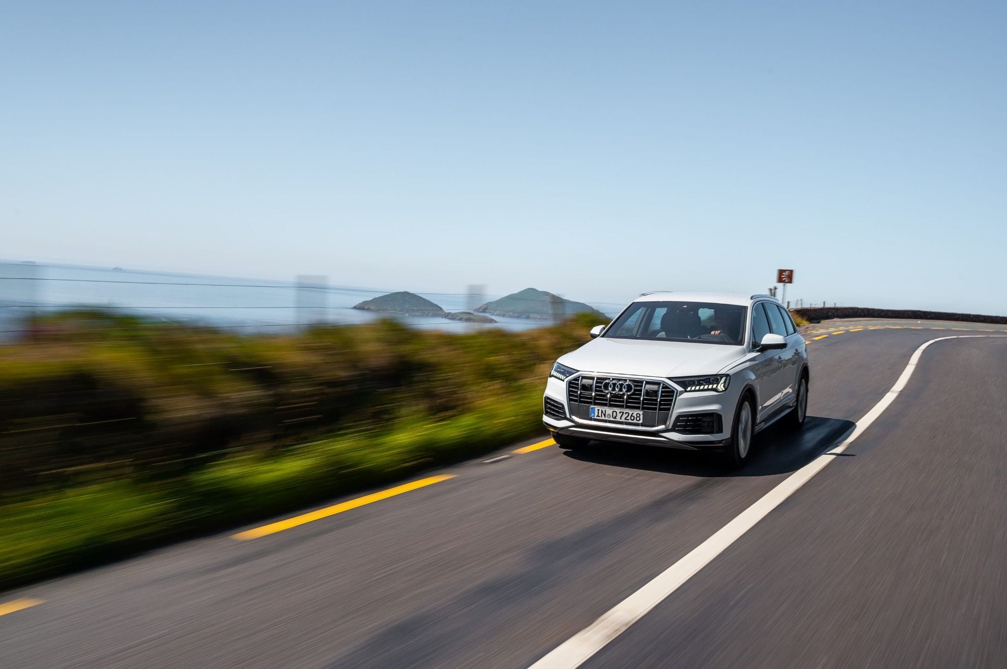 White Audi Q7 driving on a road