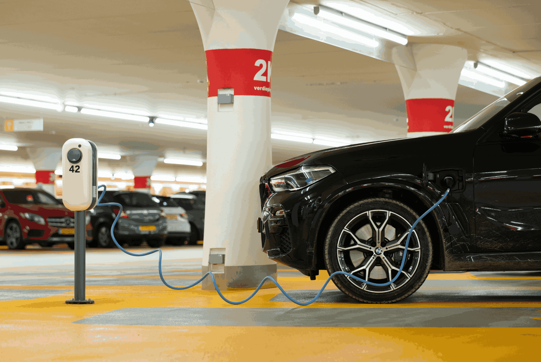 BMW EV on charge in underground car park