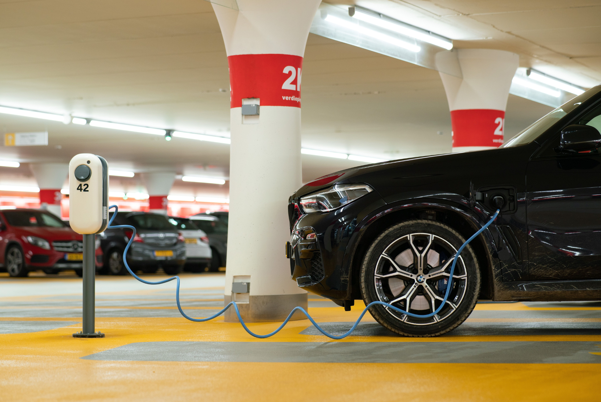 BMW EV on charge in underground car park