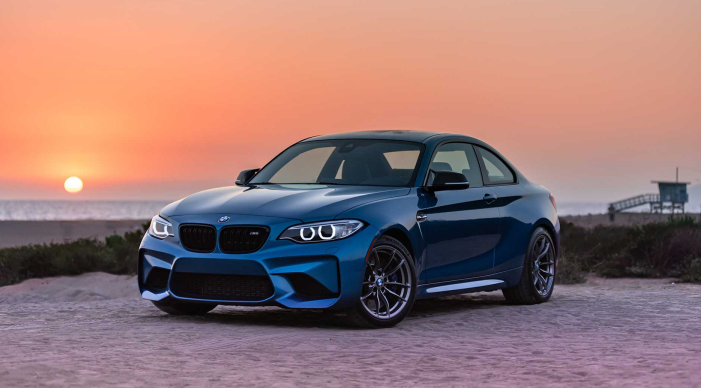 Luxury car parked in sunset