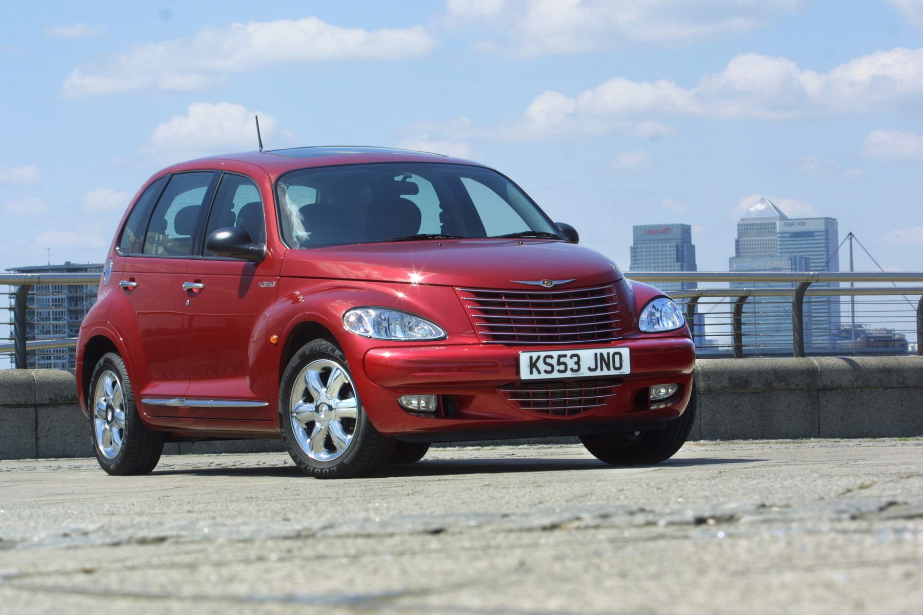 Front view of a red Chrysler PT Cruiser parked in a car park