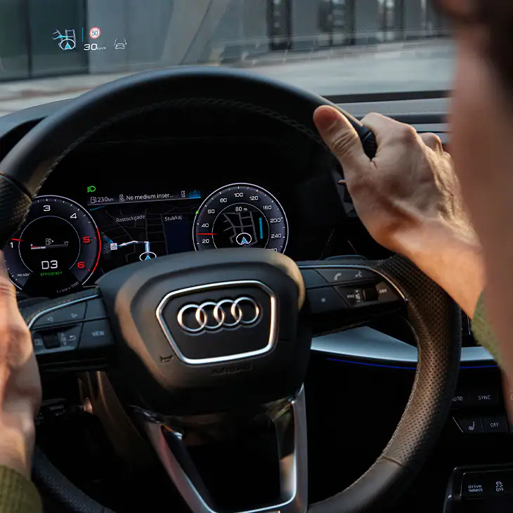 Man driving and Audi