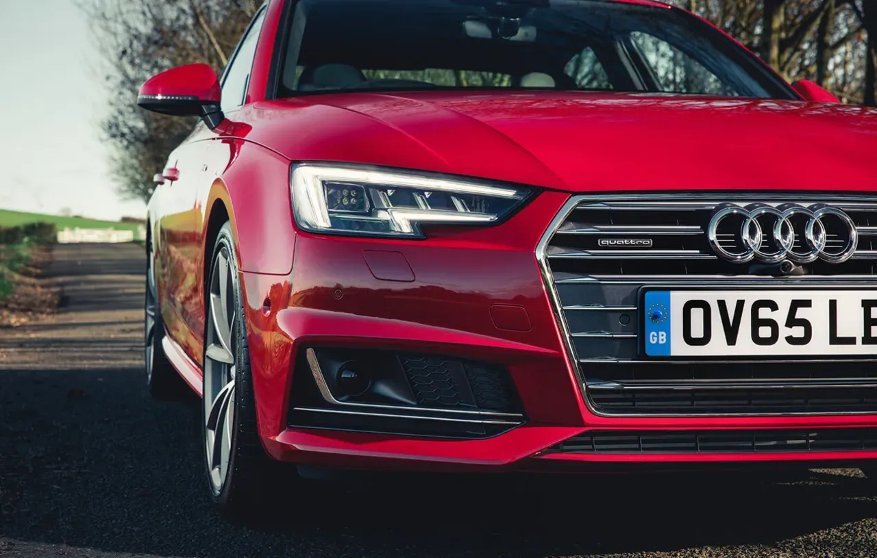 Red Audi A4 Saloon front