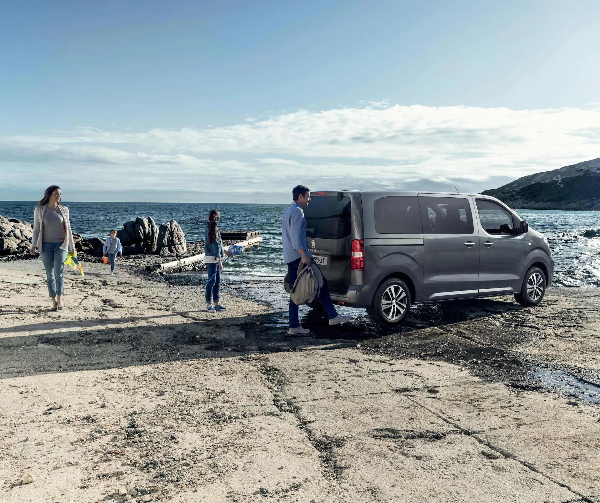e traveller parked at beach with family