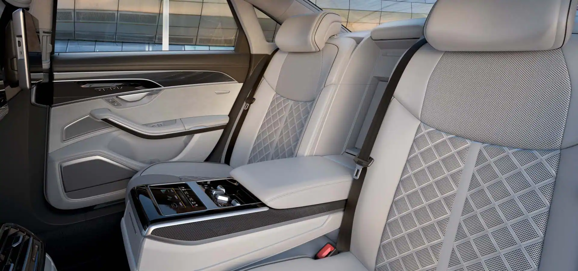 white audi s8 rear seats with middle seat folded down