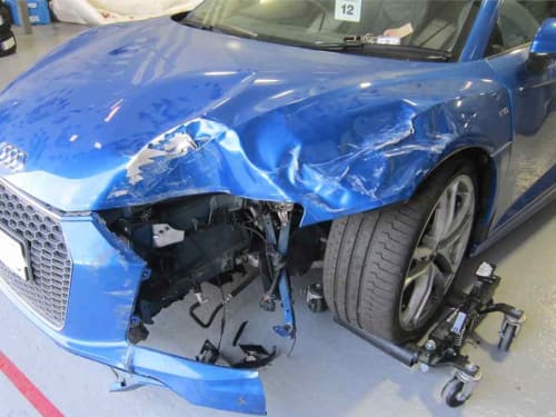 Close up of Blue Audi R8 bumper with damage