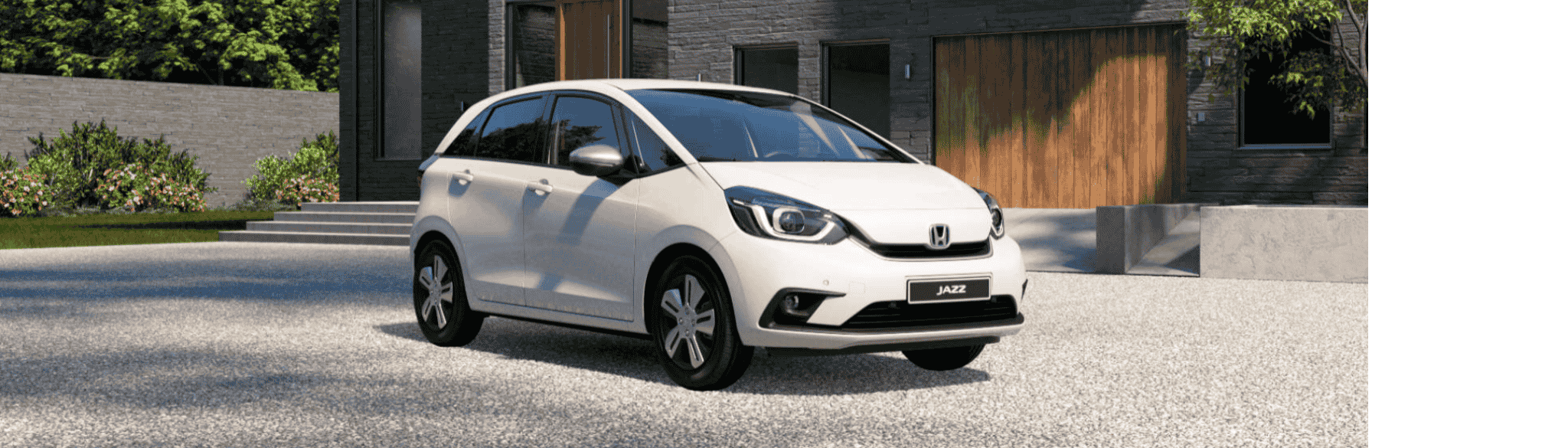White Honda Jazz outside house