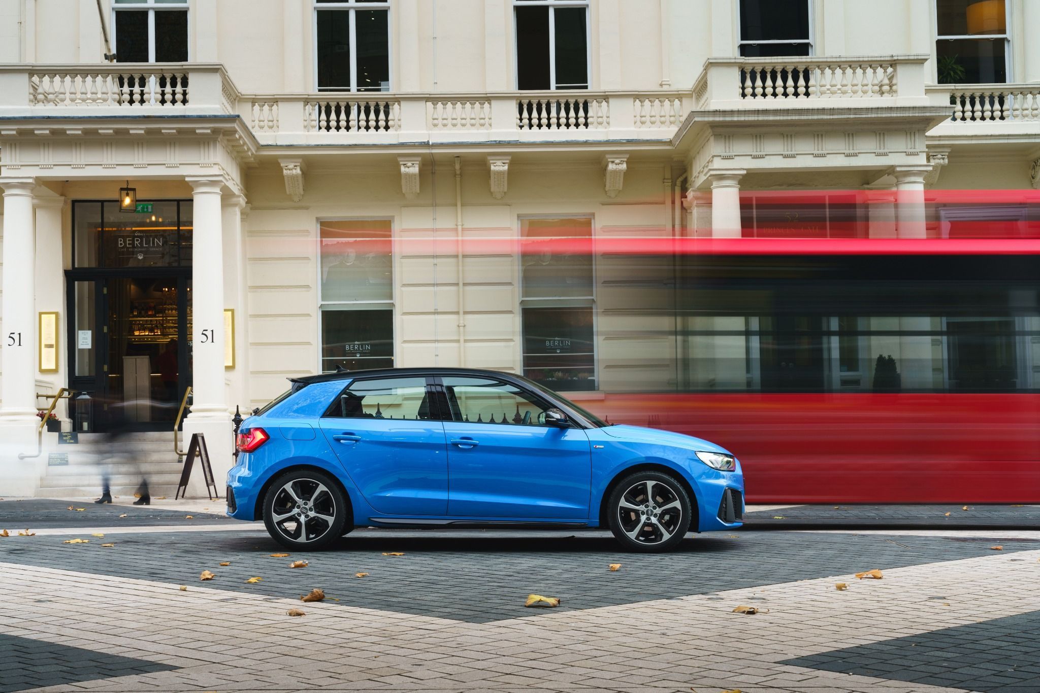 side view of a blue audi a1