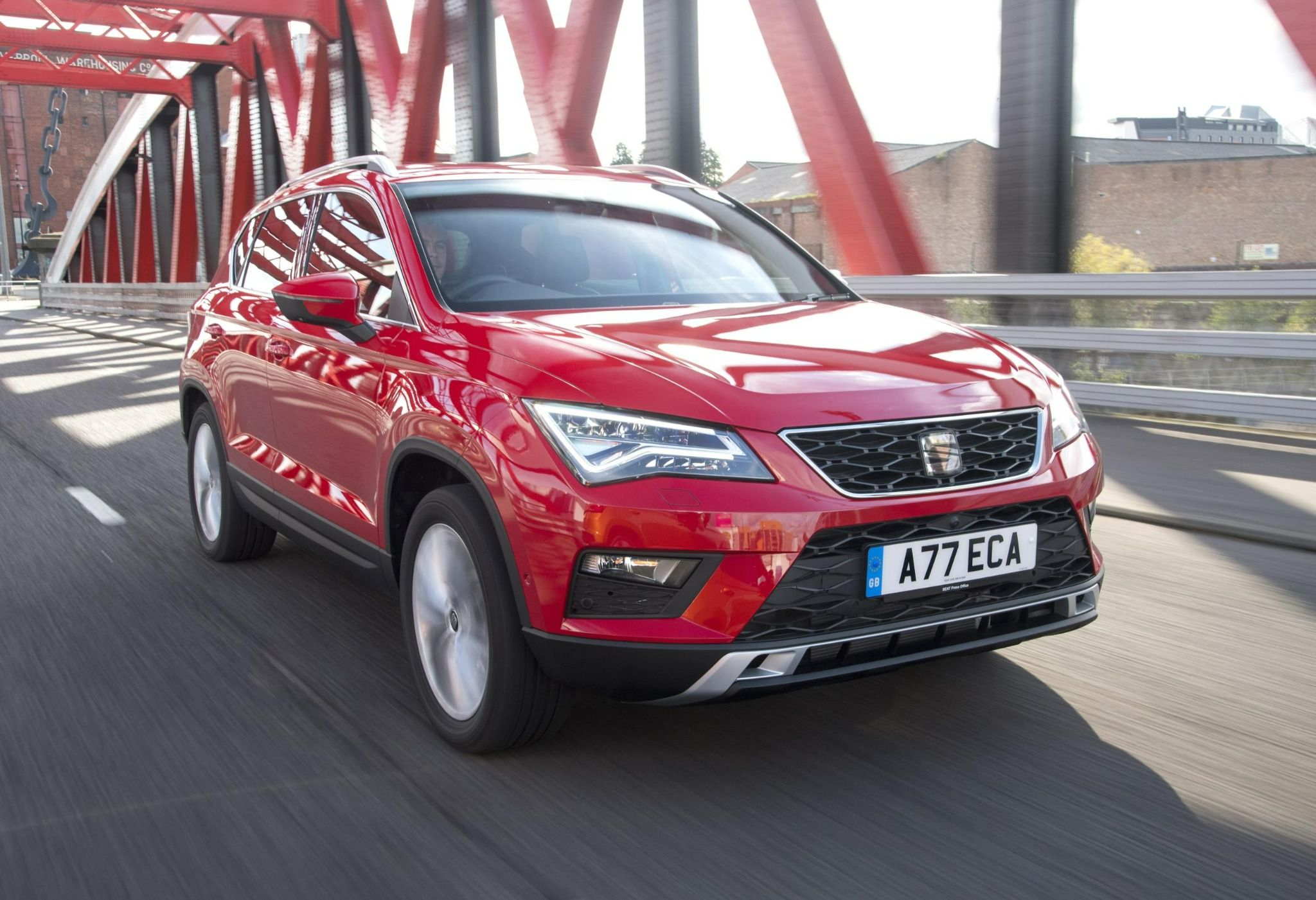 SEAT Ateca driving down a road