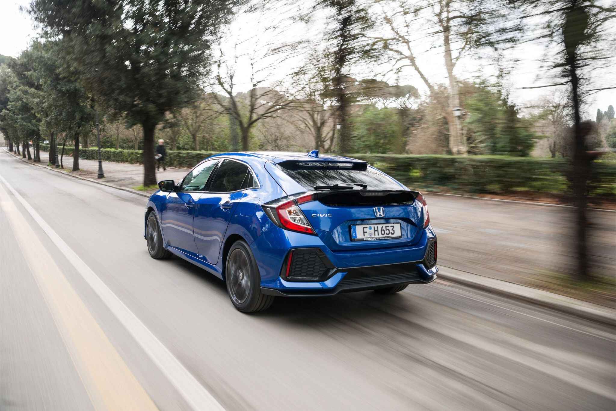 Blue Honda Civic Driving Down Road