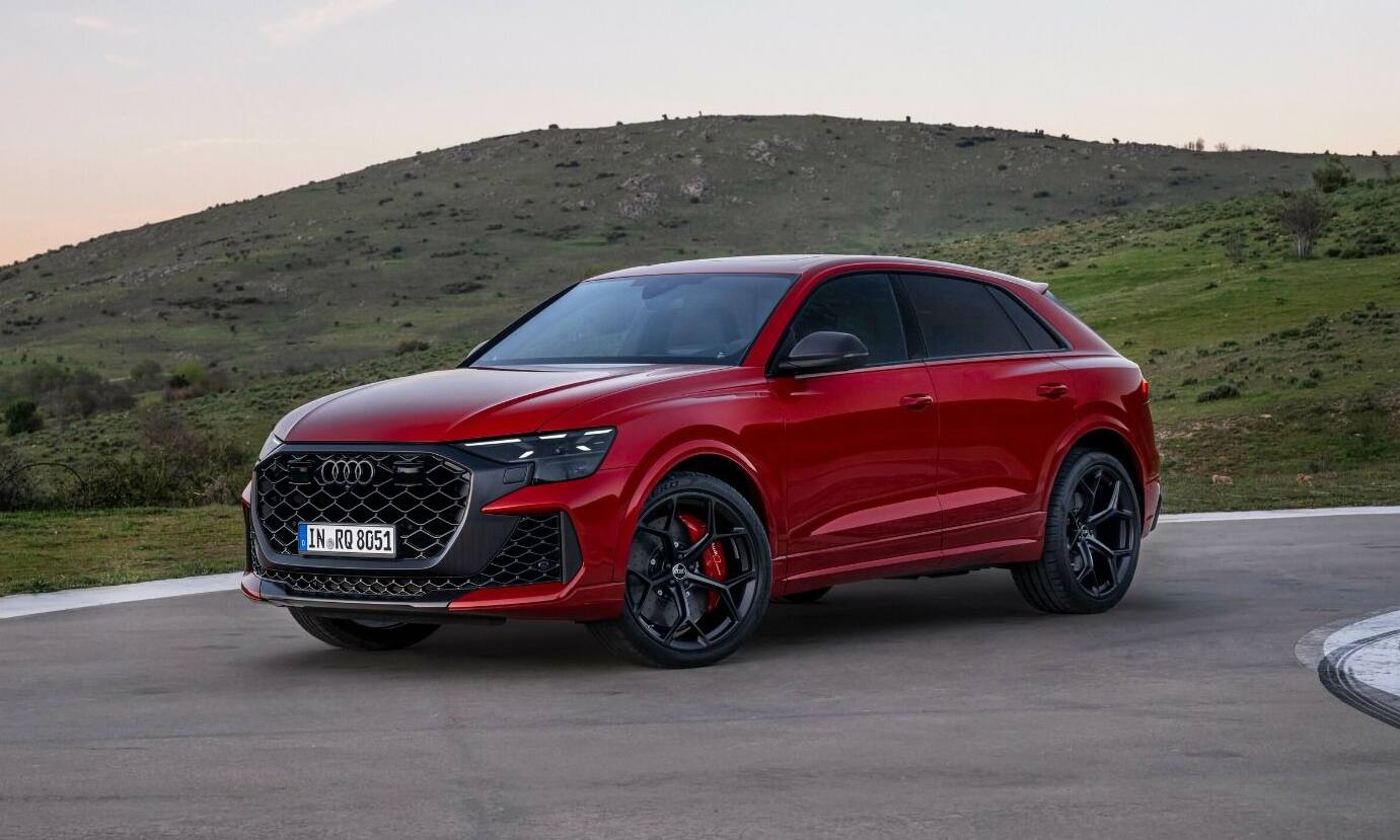 Red Audi RSQ8 Driving in the Countryside