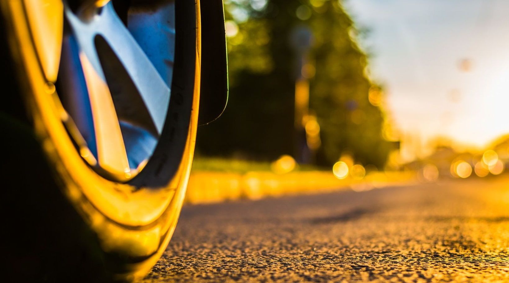 Wheel Close Up on Road in Summer