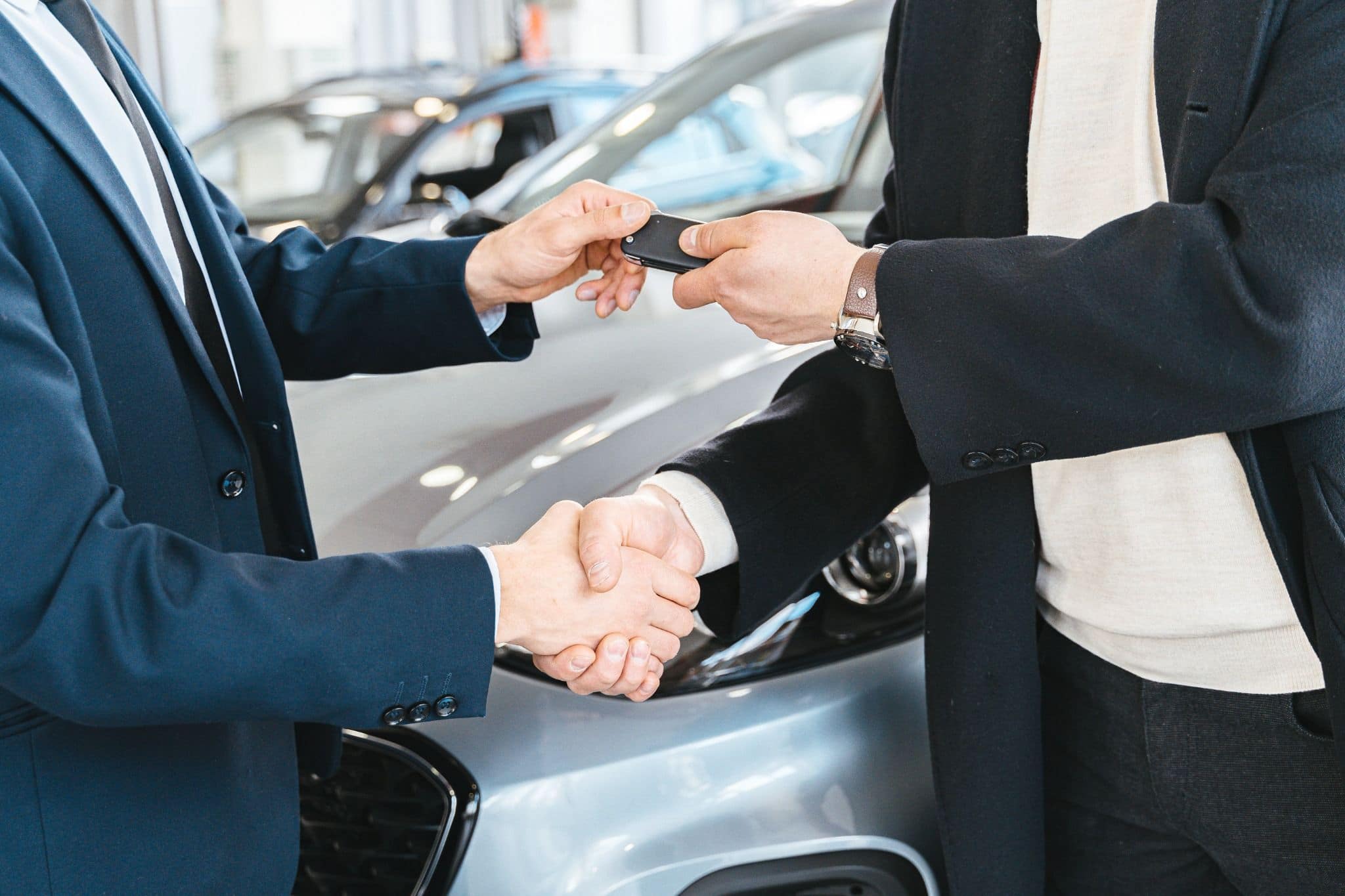 person-handing-over-car-keys