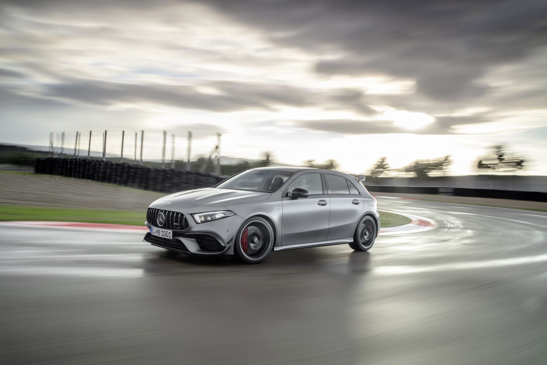 Side view of a Mercedes-Benz A45 AMG driving on a track