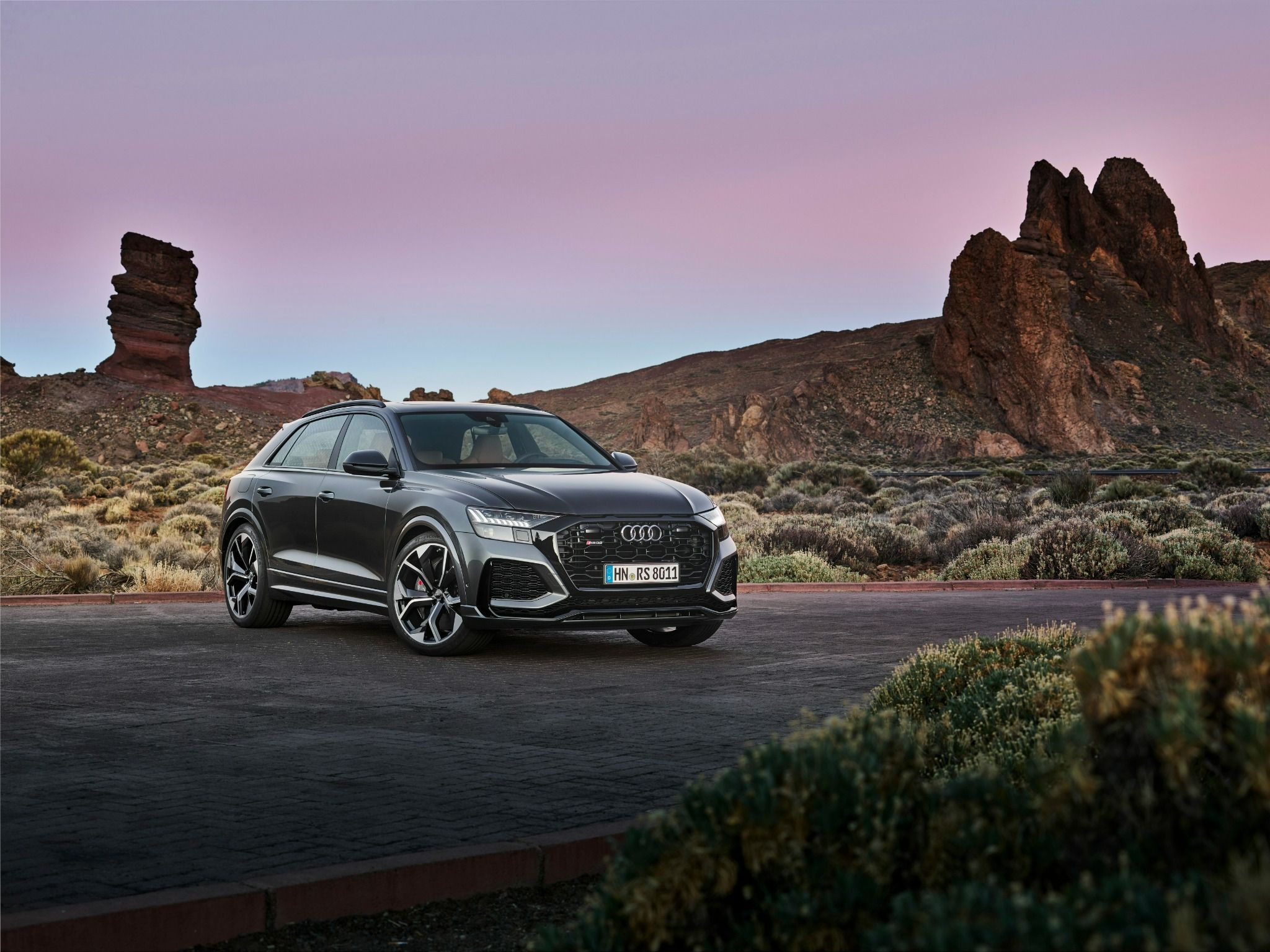 Audi RSQ8 parked between rocky mountains