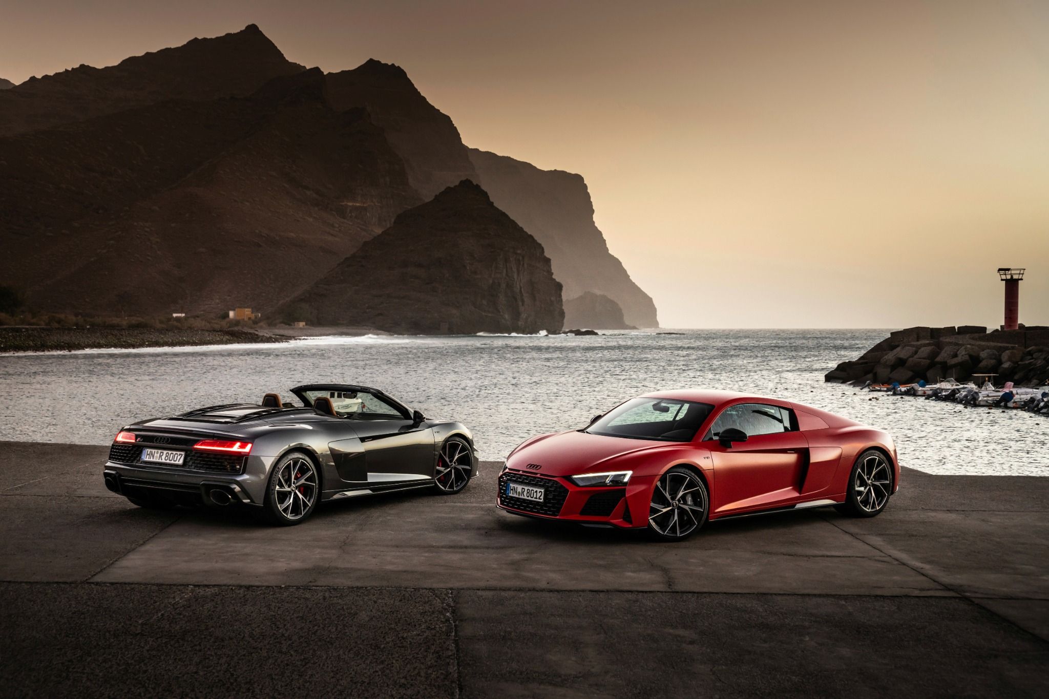 Two Grey Audi R8's with sunrise backdrop