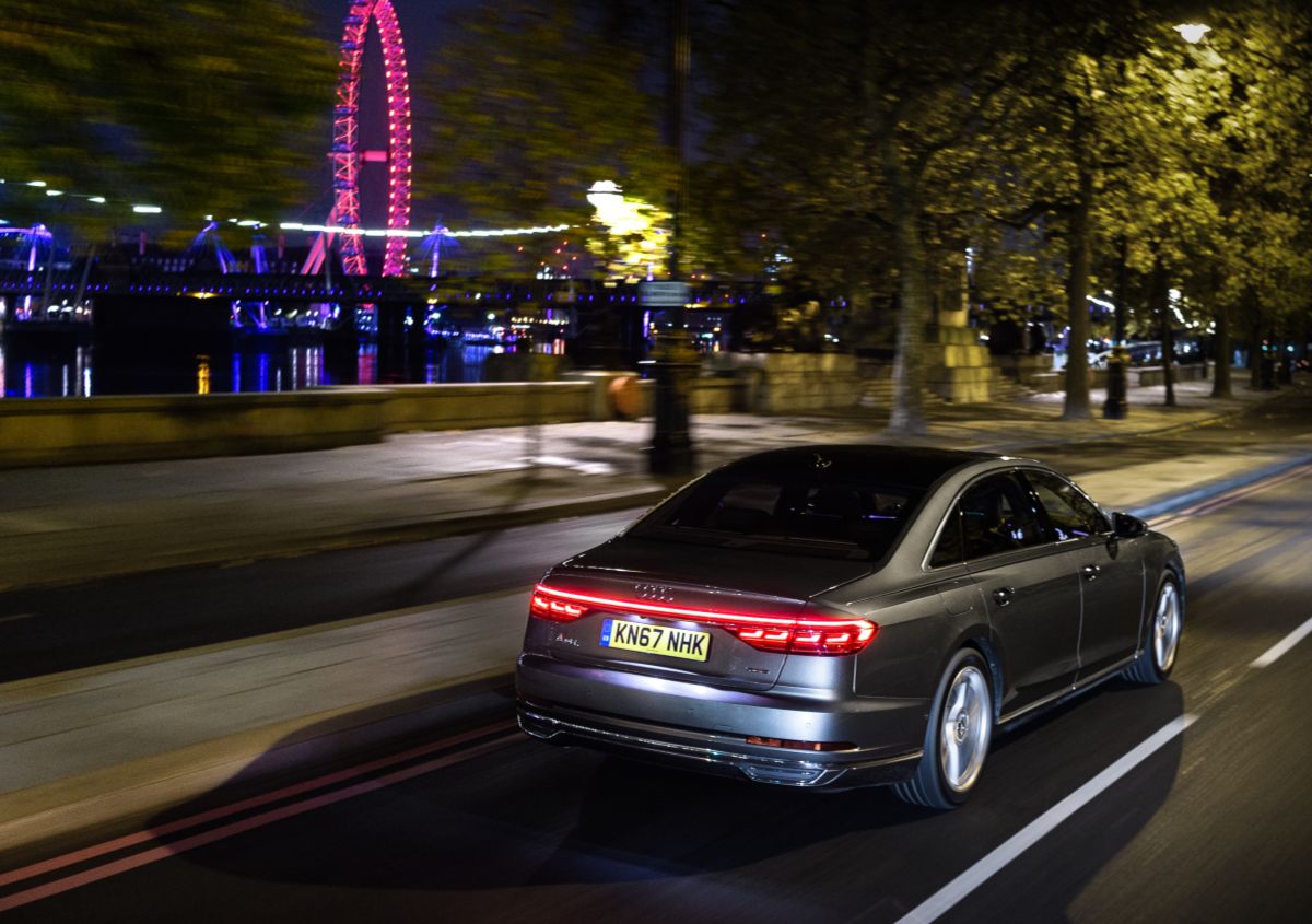 Rear view of an Audi A8 driving at night