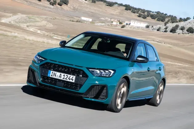 Teal Audi A1 Sportback driving on road