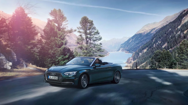Audi A5 Cabriolet driving up a hill