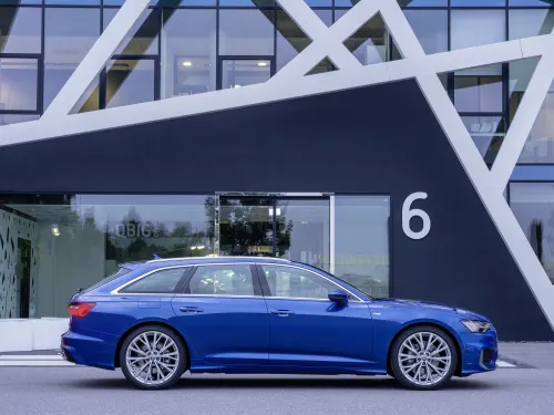 Blue Audi A6 Avant side angle parked