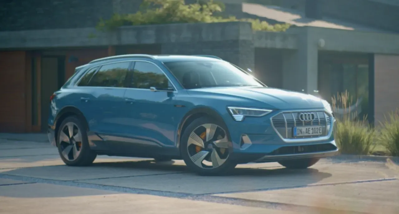 Blue Audi e-tron parked exterior front side