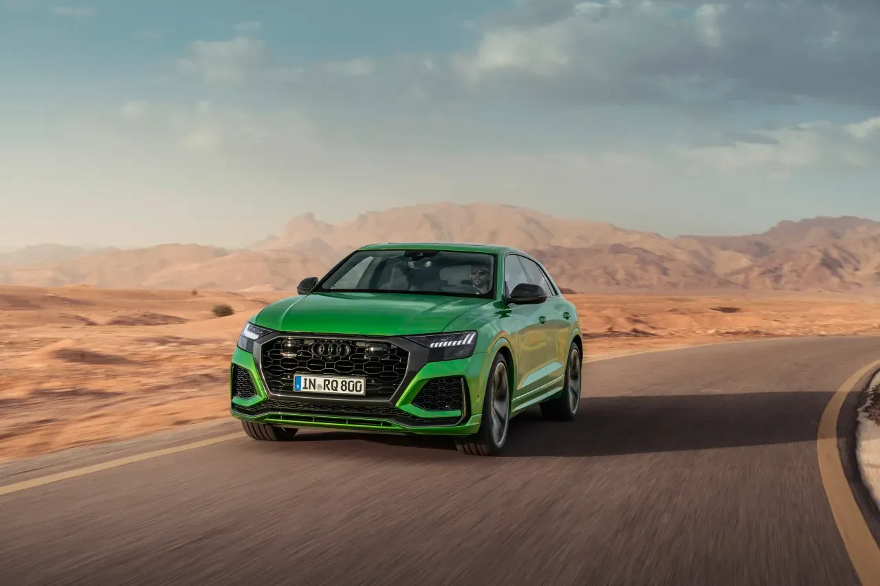 audi rs q8 front side driving along road