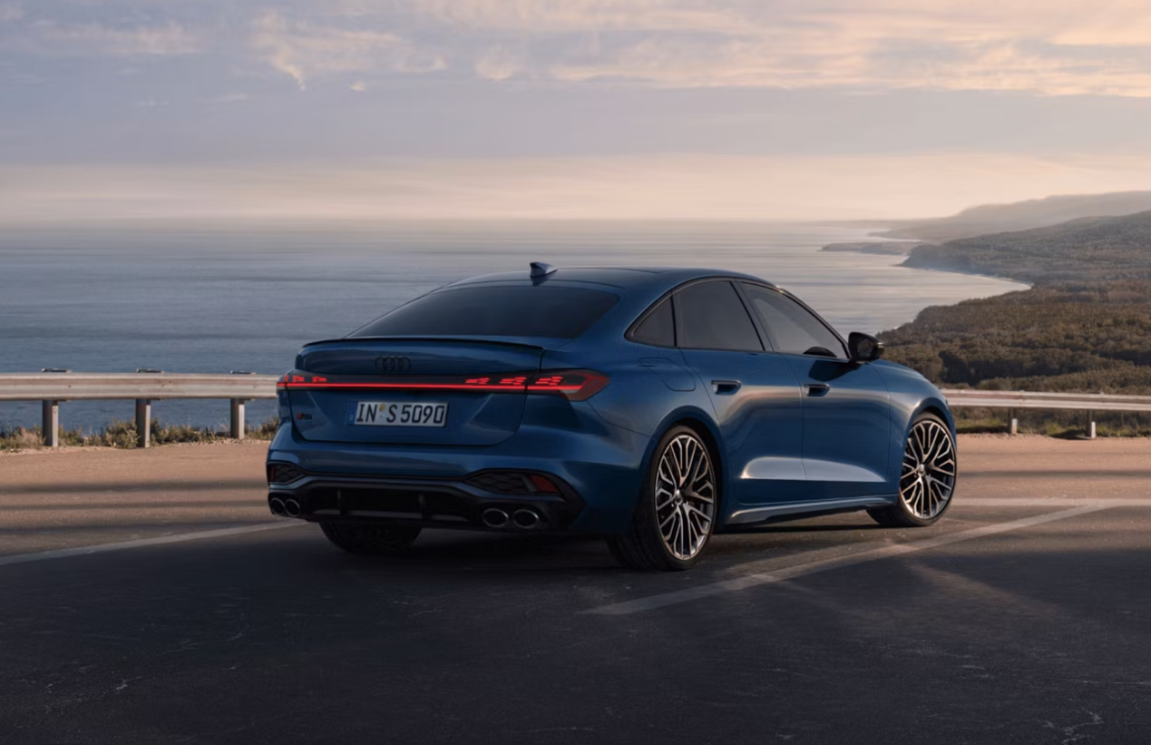 Audi S5 in blue parked in front of landscape